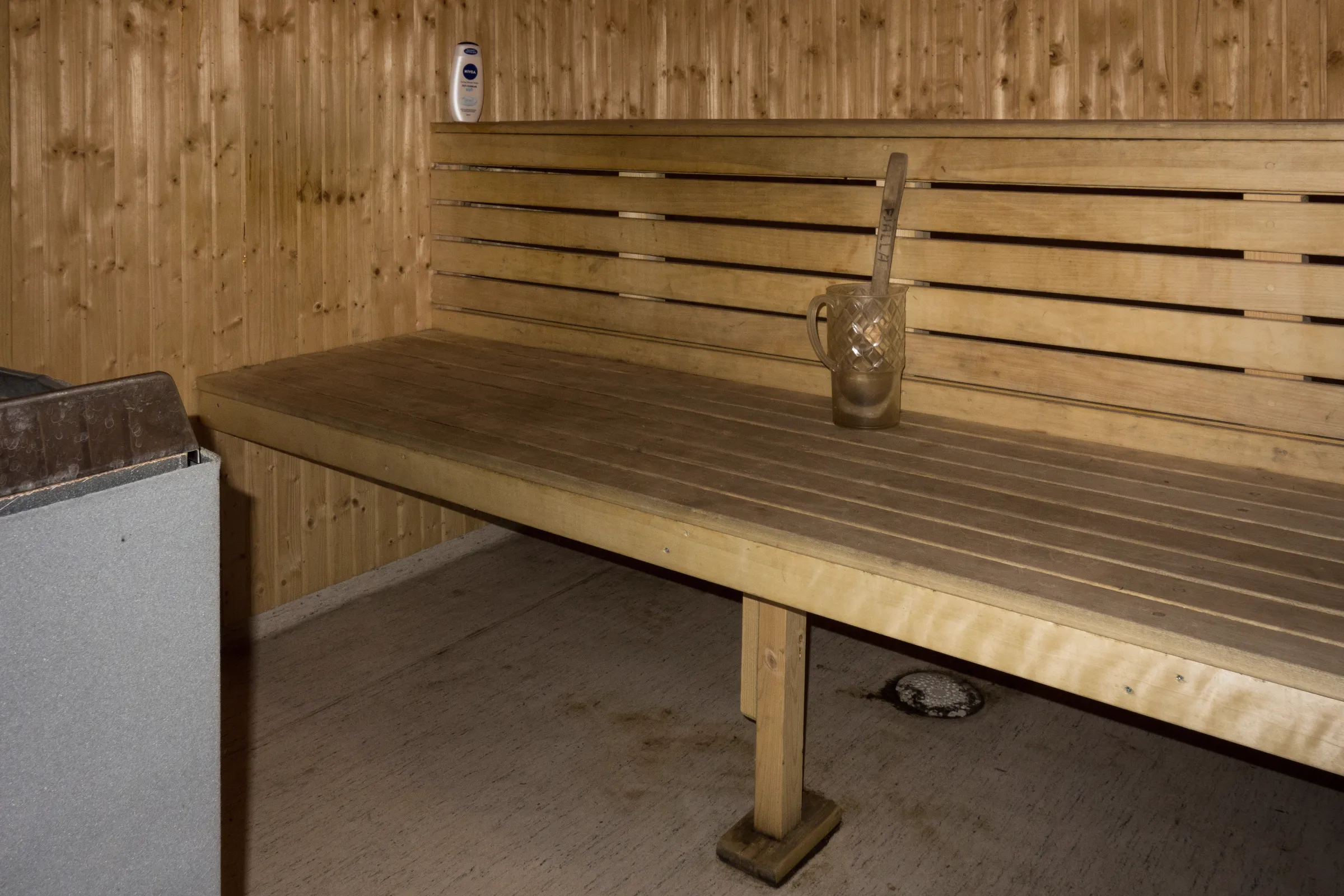 The sauna's upper bench and spruce panelling.